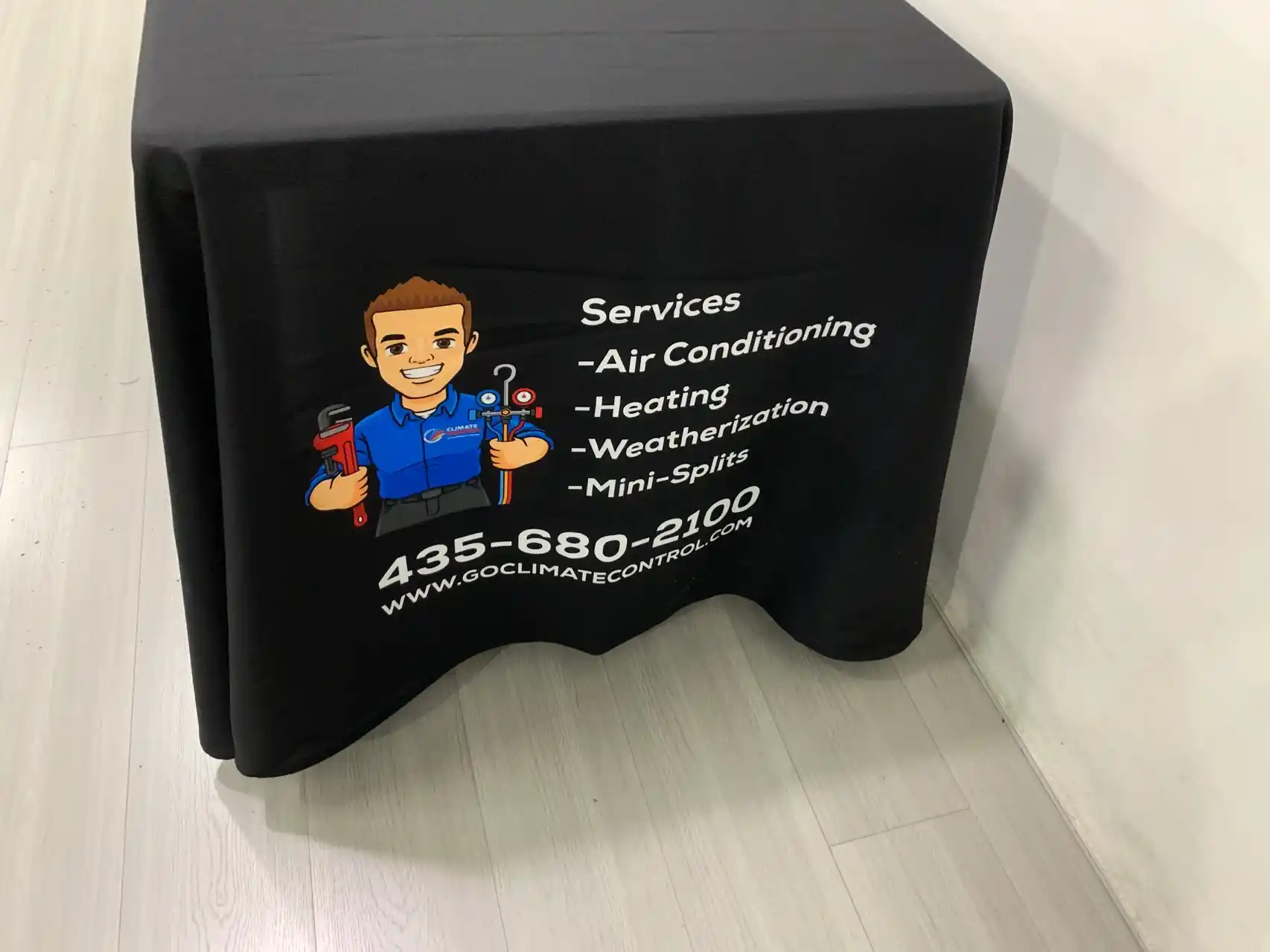 Climate Control 6-ft table cloth with services list and contact information printed on the side panel