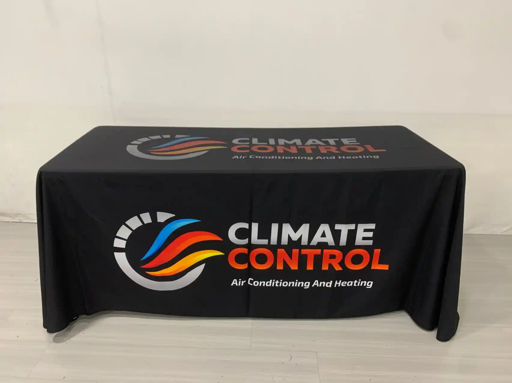 Climate Control branded 6-ft drape table cloth — angled view, oversized logo