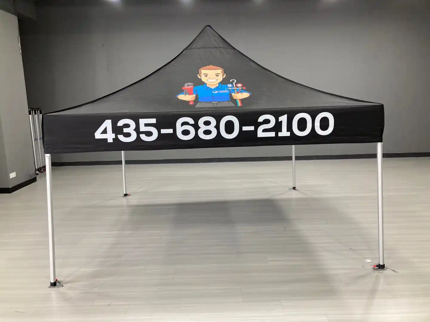 Climate Control HVAC custom 10x10 tent — black canopy with prominent phone number
